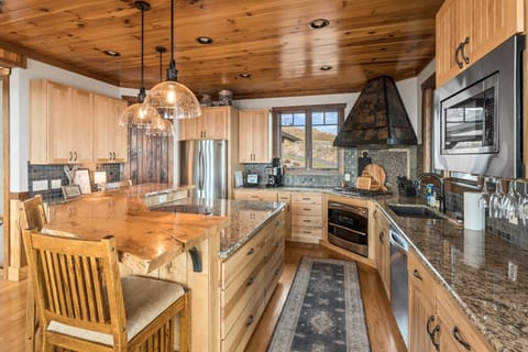 Custom Wood Bar, Granite Counters and High End Appliances