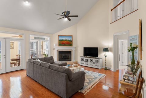 Enjoy your time in the large living room that is the center of the home- connecting to the kitchen, sunroom, primary bedroom suite, and even upstairs.