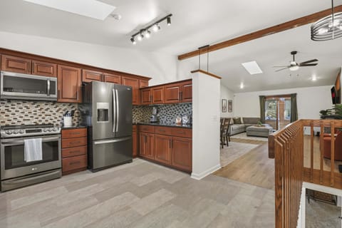 View from the front door. Fully stocked kitchen with granite countertops, coffee station, blender, cookware, toaster oven, and all other necessary cooking items.