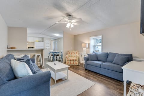 Unwind in your spacious living room with plush blue sofas and coastal accents that invite relaxation after exploring.