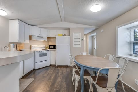 Your bright, fully equipped kitchen features modern appliances and spacious dining for memorable meals together.