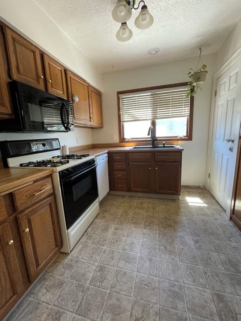 Main level kitchen with access to basement.