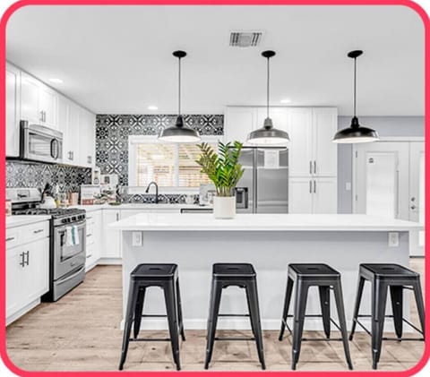 Modern culinary space with stainless steel appliances.