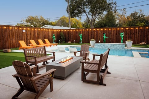 Resort backyard with pool, spa, and seating.