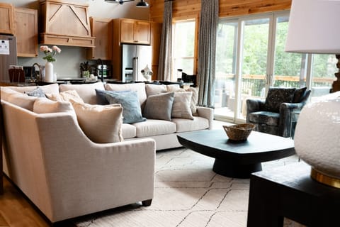 The stunning Great Room with a wall of windows…