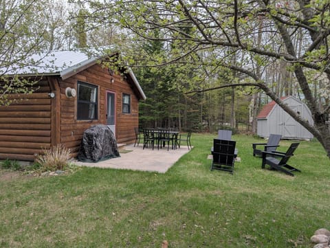 front of cabin showing patio 
, grill and outdoor seating 