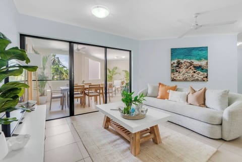 The open-plan lounge room offers direct views and access to the outdoor dining area, making it an ideal gathering place for families.
