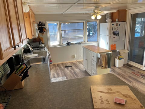 Large kitchen with rolling island.