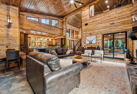 The open living area provides ample seating and warm wood accents, creating a space to enjoy time together.