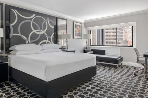 Relax with a cozy reading chair and in-room refreshment station.