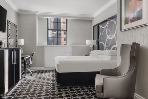Settle in with a sleek workspace and plush seating nook.