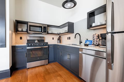 Fully equipped kitchen with modern appliances, offering everything you need for preparing meals or enjoying a morning coffee.