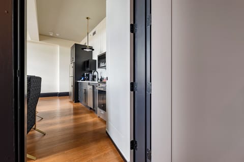 Open connection to a second unit featuring another full kitchen, living area, and additional bedrooms, providing ideal space for group stays or family gatherings.