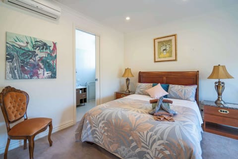Queen bed bedroom with a calming atmosphere