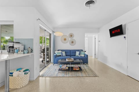 Gather in the family room, complete with a smart TV, pull-out sofa bed, and a cozy dining table for meals or games!