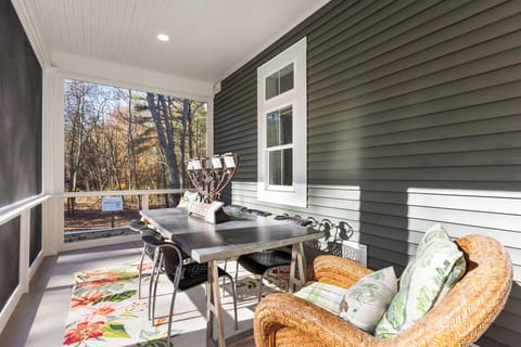 Well furnished screen porch at the front of the home.