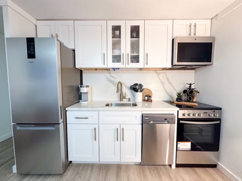A new kitchen features stainless appliances and is well-stocked for those who want to cook.