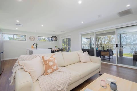 Upstairs, an open plan living and dining area flows to the deck, creating a beautiful transition between indoors and out.
