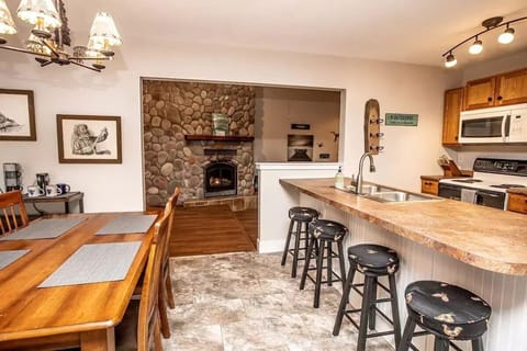 Dining area and kitchen - table seats 4 and bar seats 4.