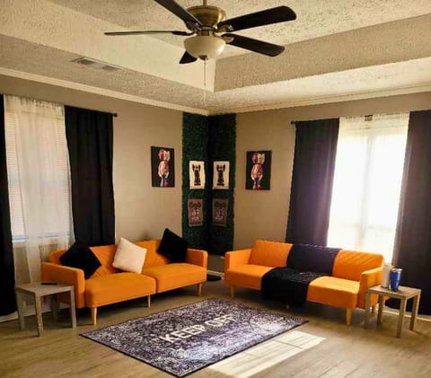 A modern living room with sleek furniture, soft lighting and minimalist decor!