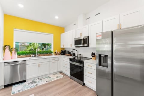 Cook in style with a fully loaded kitchen, featuring vibrant colors that add energy and charm to every meal.