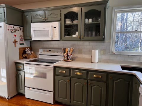Stove and oven, marble counter tops and extra large sunken kitchen sink. 