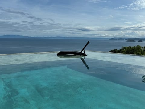Lounge chair on Villa Amor Azul's infinity pool sunshelf