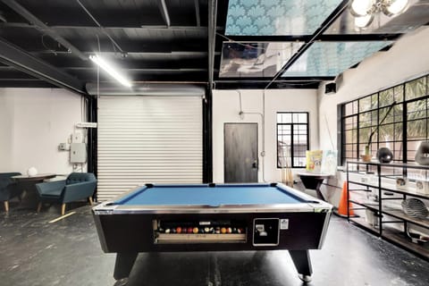 The billiards table offers fun for socializing with family and friends.
