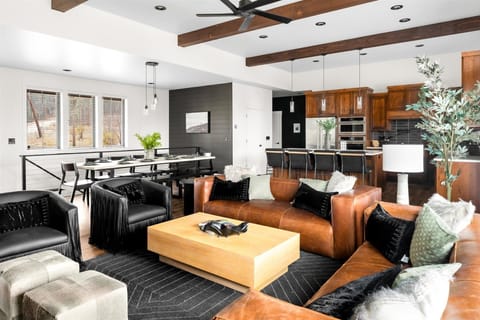 Experience effortless elegance in this luxurious open floor concept, seamlessly connecting the living, kitchen, and dining areas for the ultimate in modern living.