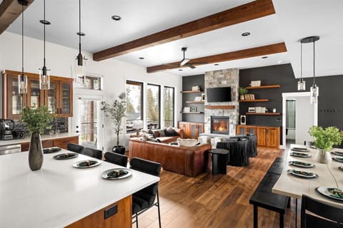 Experience effortless elegance in this luxurious open floor concept, seamlessly connecting the living, kitchen, and dining areas for the ultimate in modern living.