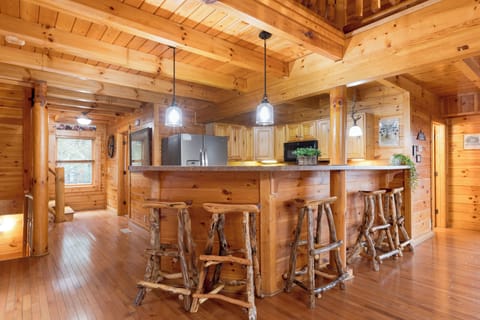Barstool seating near the kitchen.