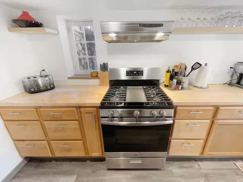 The kitchen provides ample cabinet storage and is stocked with everything you might need to prepare simple or elaborate meals during your stay.