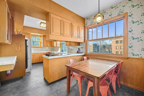 The breakfast nook in the kitchen with huge windows.