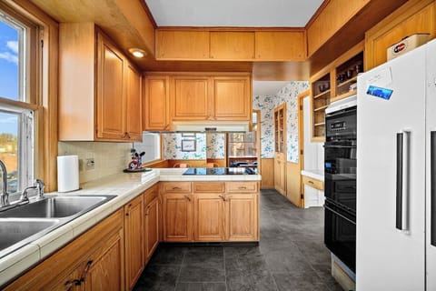 The kitchen is stocked with everything you might need such as pots & pans, bakeware, dinnerware, wine glasses and more!