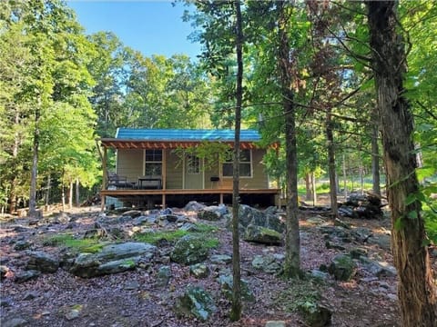 Quaint and private front porch provides a perfect setting to relax and unwind. 
