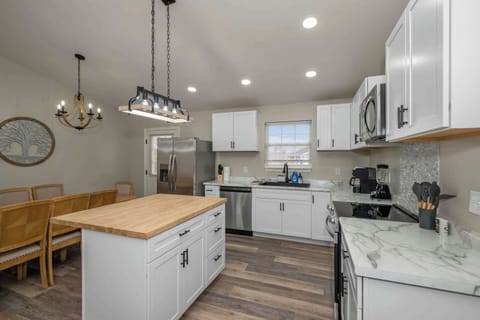 The open kitchen offers ample space & every home comfort