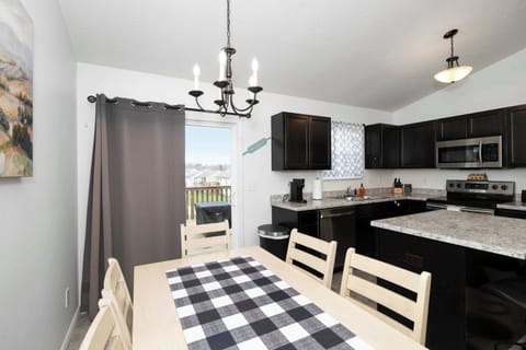 Gather for meals together at the dining table, offering seating for 6