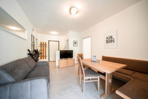 Living area with sofa and dining space