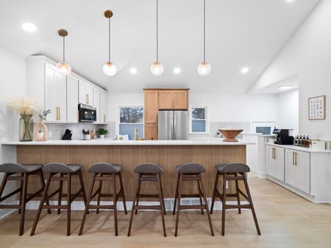 Modern farmhouse vibes, perfectly balanced.  The open concept flows seamlessly, creating a space for both work and play.