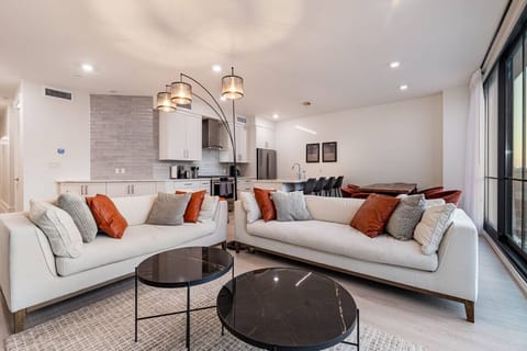 Spacious Open Concept Living Room with Floor to Ceiling Windows
