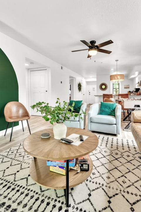Modern and comfortable decor with swivel chairs and a leather sofa. 