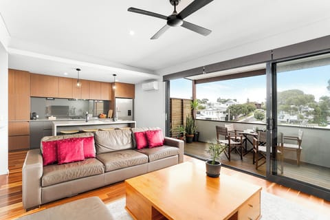 Spacious living room with direct access to the deck