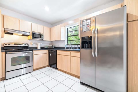 The open kitchen offers ample space & all the comforts of home