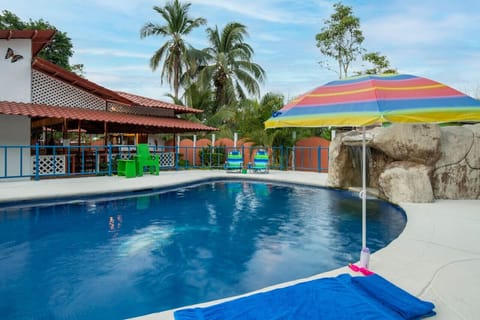 Cool off in the refreshing shared pool, a perfect spot to unwind and enjoy the sunny Costa Rican weather.