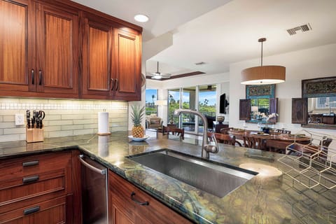 Features granite countertops, mahogany cabinets, stainless steel appliances, and ample counter space