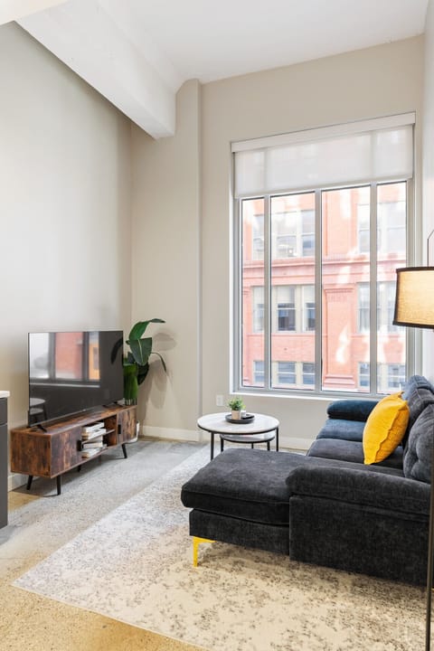 You feel at home as you settle into the living room, where the inviting atmosphere is perfect for lounging or entertaining.