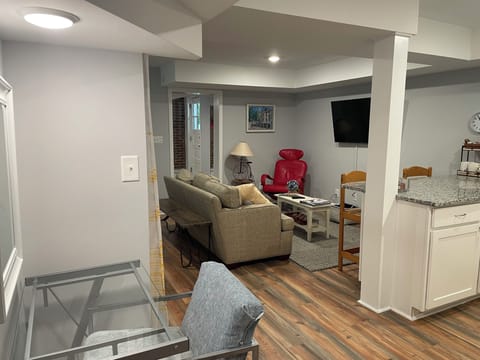 Living Area has seating area, desk, and a nook with a futon for double bet