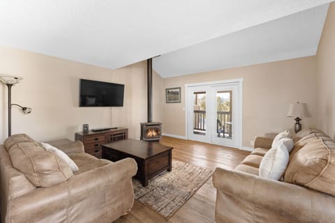 Sink into plush leather seating by your crackling fireplace, with French doors opening to your private balcony retreat.