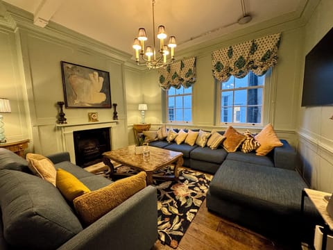 Blue TV  Family Room with large sofas and 65 inch smart TV & Sonos music player