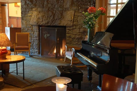 Relax fireside beside the piano in a cozy corner.